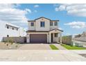 Charming two-story home boasting a neutral color scheme and a well-manicured yard at 10241 E Ursula Ave, Mesa, AZ 85212