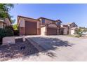 Two-story home featuring a three-car garage, concrete driveway, and low-maintenance landscaping at 12226 W Planada Ln, Sun City, AZ 85373