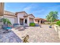 Spacious rear patio featuring full outdoor seating and a paved surface with an unobstructed sky view at 20215 N Mariposa Way, Surprise, AZ 85374