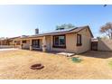 Charming single-story home with covered patio, drought tolerant landscaping, and solar panels at 2064 W 2Nd St, Mesa, AZ 85201