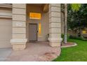 Inviting front entrance with stone accents, a covered porch, and a well-maintained lawn at 2421 W Indigo Dr, Chandler, AZ 85248