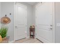 Bright entryway featuring neutral walls, with decor and convenient storage at 2499 S Entwistle St, Gilbert, AZ 85295