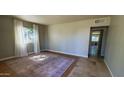 Bright living room with lots of natural light and neutral paint at 3526 E Piccadilly Rd, Phoenix, AZ 85018