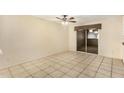 Bright dining area with tile floors, a ceiling fan, and sliding glass doors at 4219 W Pasadena Ave, Phoenix, AZ 85019