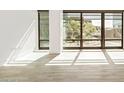 A bright living room with expansive windows providing lots of natural light at 4808 N 24Th St # 230, Phoenix, AZ 85016