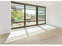 Sunlit living room featuring large windows offering a view at 4808 N 24Th St # 230, Phoenix, AZ 85016