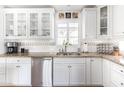 Clean kitchen with white cabinets, granite countertops, and stainless steel appliances at 5808 N 18Th Pl, Phoenix, AZ 85016
