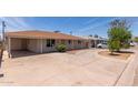 Ranch style house showing long driveway, carport, and low maintenance landscaping at 6126 N 31St Dr, Phoenix, AZ 85017