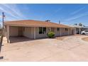 Ranch style house showing long driveway, carport, and low maintenance landscaping at 6126 N 31St Dr, Phoenix, AZ 85017