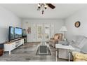 Cozy living area with tile floors, comfortable seating, and a view of the outdoors at 614 N Pioneer Cir, Mesa, AZ 85203