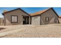 Attractive single-story home featuring desert landscaping and a covered front porch at 7506 W Sells Dr, Phoenix, AZ 85033