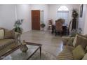Inviting living room with hardwood floors, comfortable seating, and a formal dining area at 1819 E Sheena Dr, Phoenix, AZ 85022