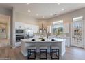 Spacious kitchen featuring a large island, stainless steel appliances, and ample counter space at 19608 N Regents Park Dr, Surprise, AZ 85387