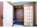 Inviting entryway featuring double doors with decorative glass panels, offering a warm welcome at 20609 N 4Th Ave, Phoenix, AZ 85027