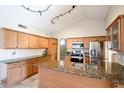 Bright kitchen with granite countertops, stainless steel appliances, and a spacious island, perfect for gatherings at 20609 N 4Th Ave, Phoenix, AZ 85027