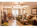 Spacious living room with modern furnishings and a seamless transition to the dining area at 2101 S Meridian Rd # 176, Apache Junction, AZ 85120