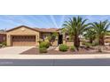 Charming home with desert landscaping, a gated courtyard, and meticulously maintained curb appeal at 27380 N 128Th Ln, Peoria, AZ 85383