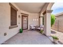 Inviting front porch featuring comfortable seating, a decorative door, and stylish decor at 3029 E Patrick St, Gilbert, AZ 85295