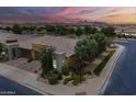 Twilight aerial shot of the property showcasing desert landscaping, mountain views, and neighborhood at 36042 N Desert Tea Dr, Queen Creek, AZ 85140