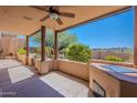 Covered patio with ceiling fan, outdoor kitchen and scenic desert view at 38065 N Cave Creek Rd # 52, Cave Creek, AZ 85331