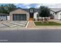 Charming home with well-manicured lawn and landscaping provides superb curb appeal at 4132 N 42Nd St, Phoenix, AZ 85018