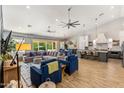 Open-concept living space featuring comfortable seating and an adjacent modern kitchen with bar seating at 4132 N 42Nd St, Phoenix, AZ 85018
