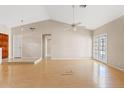 Bright living room featuring neutral walls, ceiling fan, and door to backyard at 917 E Lexington Ave, Gilbert, AZ 85234