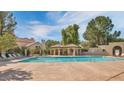 Relaxing community pool featuring lounge chairs and shaded seating areas at 921 W University Dr # 1191, Mesa, AZ 85201