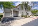 Well-maintained building exterior with attached garages, mature landscaping, and a clean, inviting facade at 9750 N Monterey Dr # 71, Fountain Hills, AZ 85268