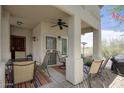 Cozy covered patio with outdoor seating, a ceiling fan, and a grill perfect for relaxing and entertaining at 9750 N Monterey Dr # 71, Fountain Hills, AZ 85268