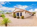 Charming exterior of the home featuring low-maintenance landscaping and a well-kept yard at 11807 E Clinton St, Scottsdale, AZ 85259
