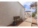 Charming front courtyard features a wrought iron gate, stucco walls, and a comfortable seating area at 1309 E Meadow Ln, Phoenix, AZ 85022