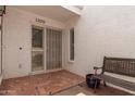 Inviting front entry with custom tile flooring, wrought iron security door, and covered patio area at 1309 E Meadow Ln, Phoenix, AZ 85022