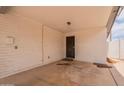 A simple carport features painted walls and a covered ceiling at 1654 E 2Nd St, Mesa, AZ 85203