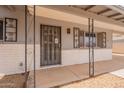 Charming front porch features an ornate security screen door and decorative window accents at 1654 E 2Nd St, Mesa, AZ 85203