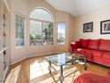 Bright living room with hardwood floors, a large window, and an inviting space to relax at 20404 N 28Th Pl, Phoenix, AZ 85050