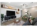 Modern living room features stylish decor, a ceiling fan, and wood-look flooring at 2044 W 1St St, Mesa, AZ 85201