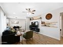 Open living room showcases a ceiling fan and seamless flow into the dining area at 2044 W 1St St, Mesa, AZ 85201