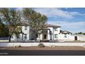 Elegant front facade of a two-story home with manicured landscaping, providing curb appeal at 2060 E Quartz St, Mesa, AZ 85213