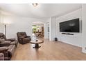 Spacious living room featuring tile flooring, a ceiling fan, and comfortable seating, perfect for relaxation at 2641 E Binner Dr, Chandler, AZ 85225