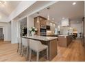 Spacious modern kitchen with a marble breakfast bar, stainless steel appliances, and hardwood flooring at 2737 E Arizona Biltmore Cir # 8, Phoenix, AZ 85016