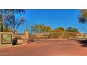 Terra Vista community gate with brick-paved entrance, desert landscaping, and clear blue sky at 29606 N Tatum Blvd # 204, Cave Creek, AZ 85331