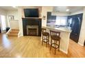 Cozy living room with hardwood floors and modern electric fireplace insert at 4805 E Kachina Trl # 25, Phoenix, AZ 85044