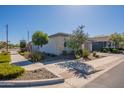Street view of the house shows a well-landscaped yard and a quiet neighborhood at 4925 S Turbine --, Mesa, AZ 85212