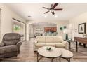 Inviting living room with hardwood floors, neutral walls, and a comfortable seating arrangement at 5749 S Dragoon Dr, Chandler, AZ 85249