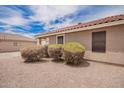 This house has desert landscaping with pebble ground cover and bushes at 6085 S Wilson Dr, Chandler, AZ 85249