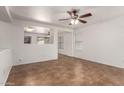 Open living room featuring neutral walls, tile floors, and a ceiling fan at 6085 S Wilson Dr, Chandler, AZ 85249