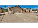 Large driveway leading to a convenient two-car garage in a well-maintained residential area at 6602 W Ironwood Dr, Glendale, AZ 85302