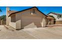 Spacious garage with ample driveway space, perfect for multiple vehicles and easy access at 6602 W Ironwood Dr, Glendale, AZ 85302