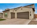 Spacious three-car garage with brick-paved driveway enhances the curb appeal of this lovely home at 9508 W Jj Ranch Rd, Peoria, AZ 85383